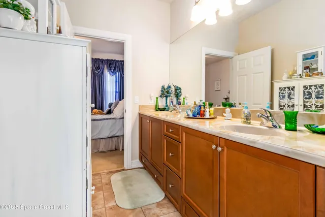 a bathroom with a sink vanity and a mirror