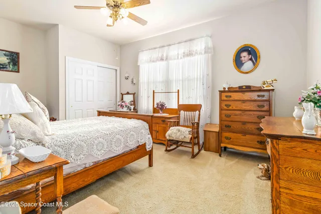 a view of a house with swimming pool and sitting area