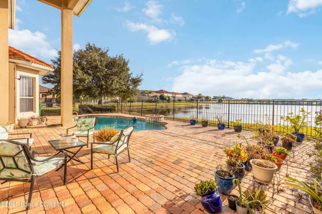 an aerial view of residential house with outdoor space and pool