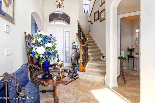 a view of entryway with paintings on the wall
