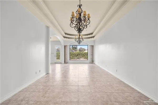 a view of a kitchen with kitchen island stainless steel appliances refrigerator stove and a sink with wooden floor