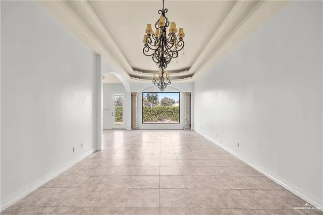 a view of a kitchen with kitchen island stainless steel appliances refrigerator stove and a sink with wooden floor