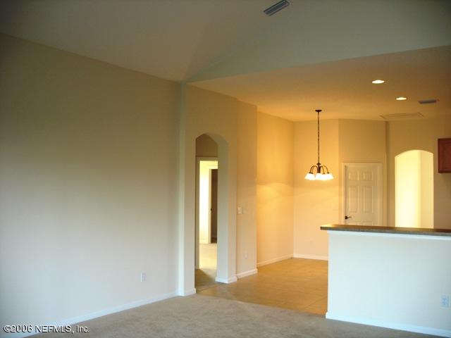 241 Porta Rosa Circle St. Augustine, FL 32092 - Photo 7 of 16 FAMILY ROOM TO KITCHEN
