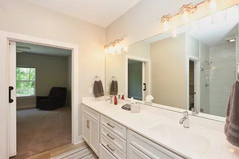 a bathroom with a double vanity sink and mirror