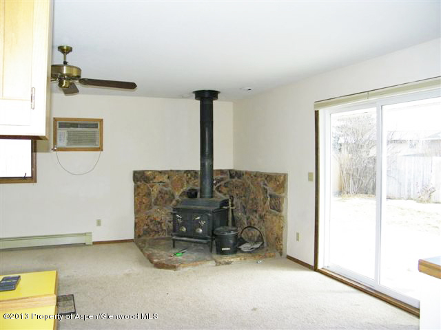 749 Cactus Court Rifle, CO 81650 - Photo 5 of 12 a room with furniture and a fireplace