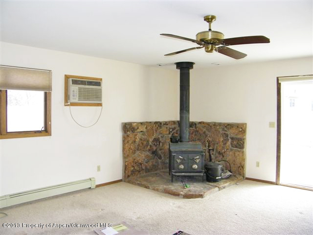749 Cactus Court Rifle, CO 81650 - Photo 6 of 12 a living room with furniture and a chandelier