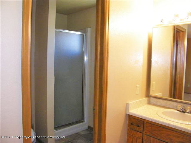 749 Cactus Court Rifle, CO 81650 - Photo 10 of 12 a bathroom with a sink and a mirror