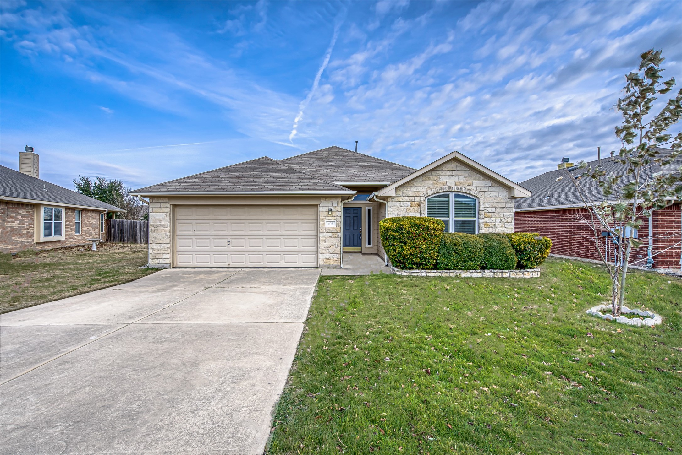 102 Chandler View Trail Round Rock, TX 78665 - Photo 2 of 26 front view of a house with a yard