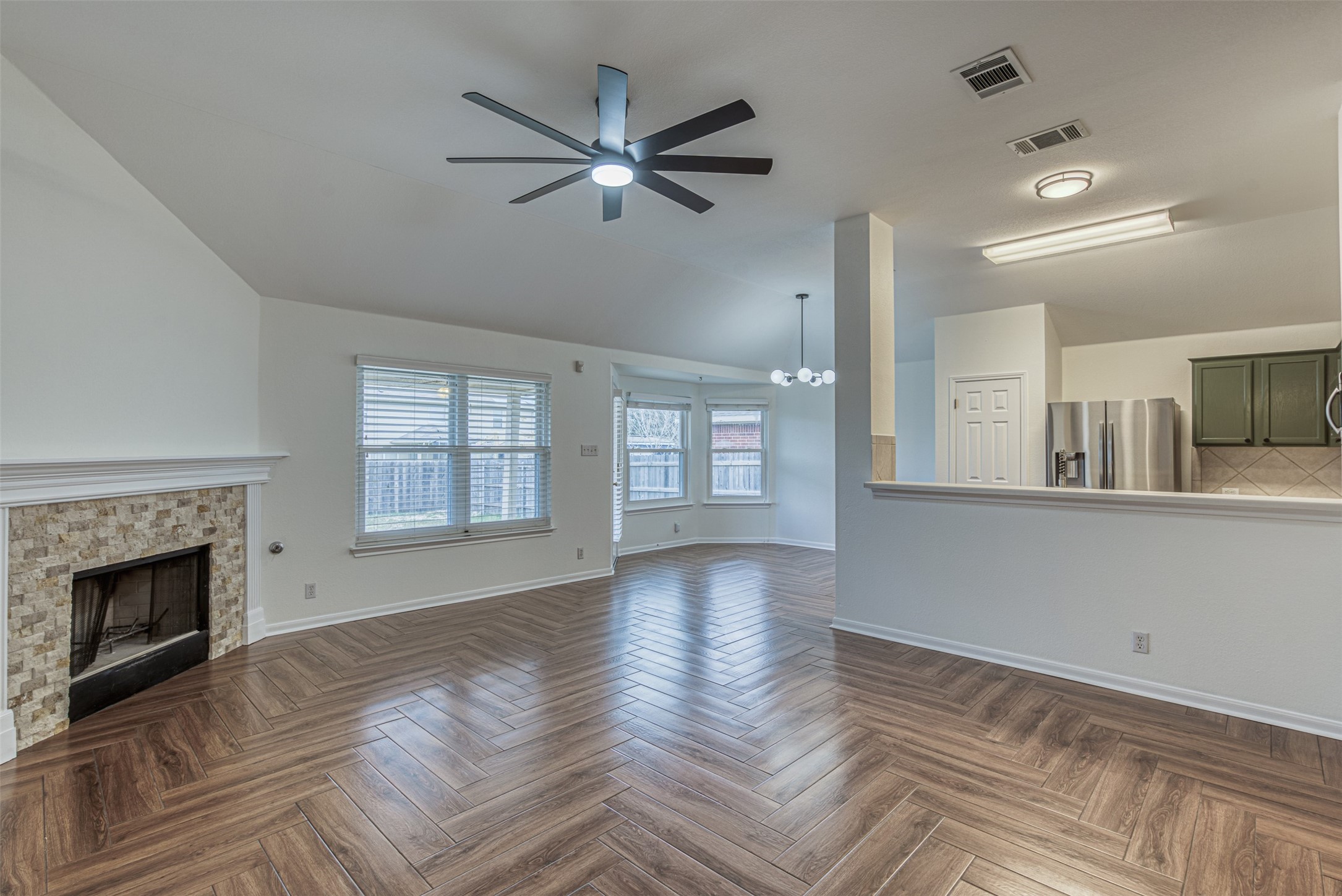 102 Chandler View Trail Round Rock, TX 78665 - Photo 5 of 26 a view of an empty room with a fireplace and a window