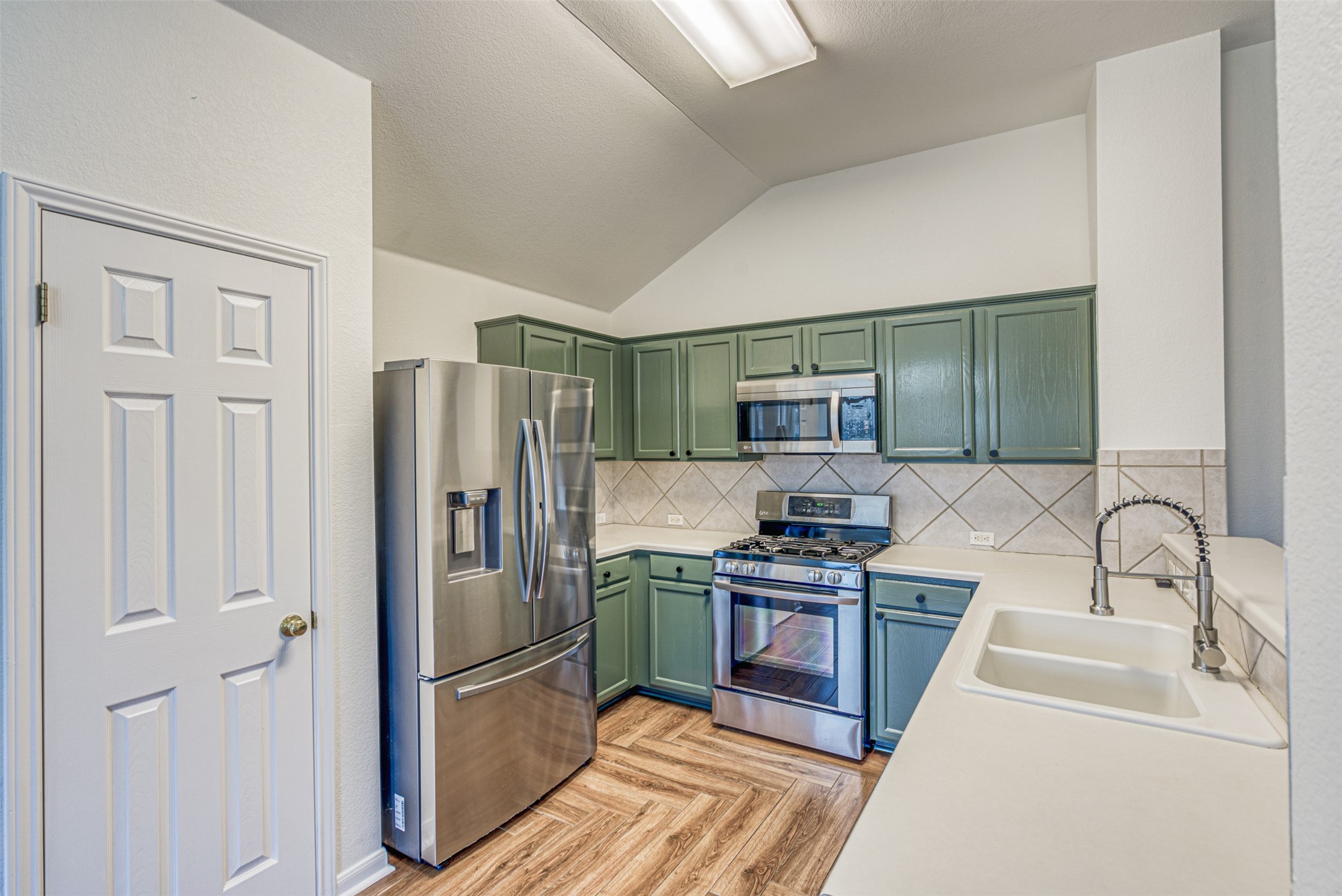 102 Chandler View Trail Round Rock, TX 78665 - Photo 10 of 26 a kitchen with stainless steel appliances granite countertop a refrigerator stove and sink