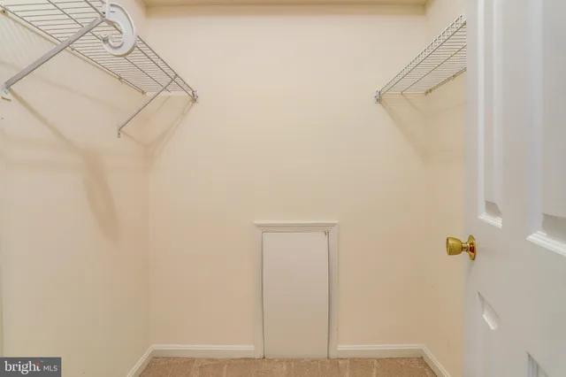 a view of small space with empty racks on the wall