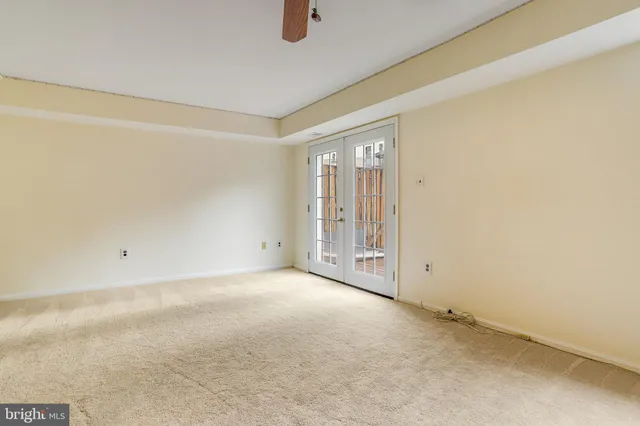 a bathroom with a toilet sink vanity and mirror