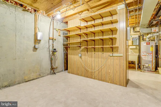 a view of a house with a wooden fence