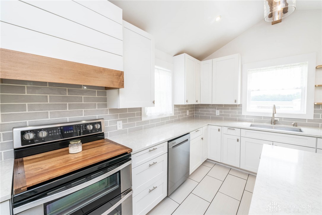 190 Swailes Road Troy, OH 45373 - Photo 5 of 82 Bright and airy kitchen featuring pristine white cabinetry and modern appliances.