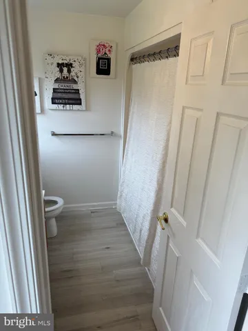 a view of a hallway and a washer and dryer