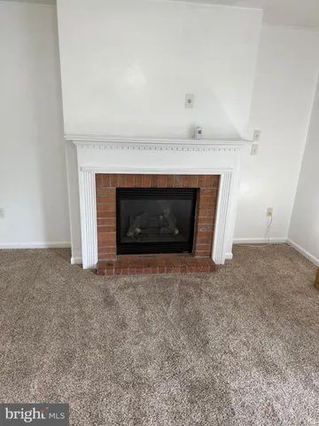 a view of a chair and tables in the balcony