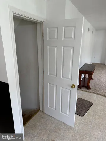 a view of a livingroom with furniture and staircase