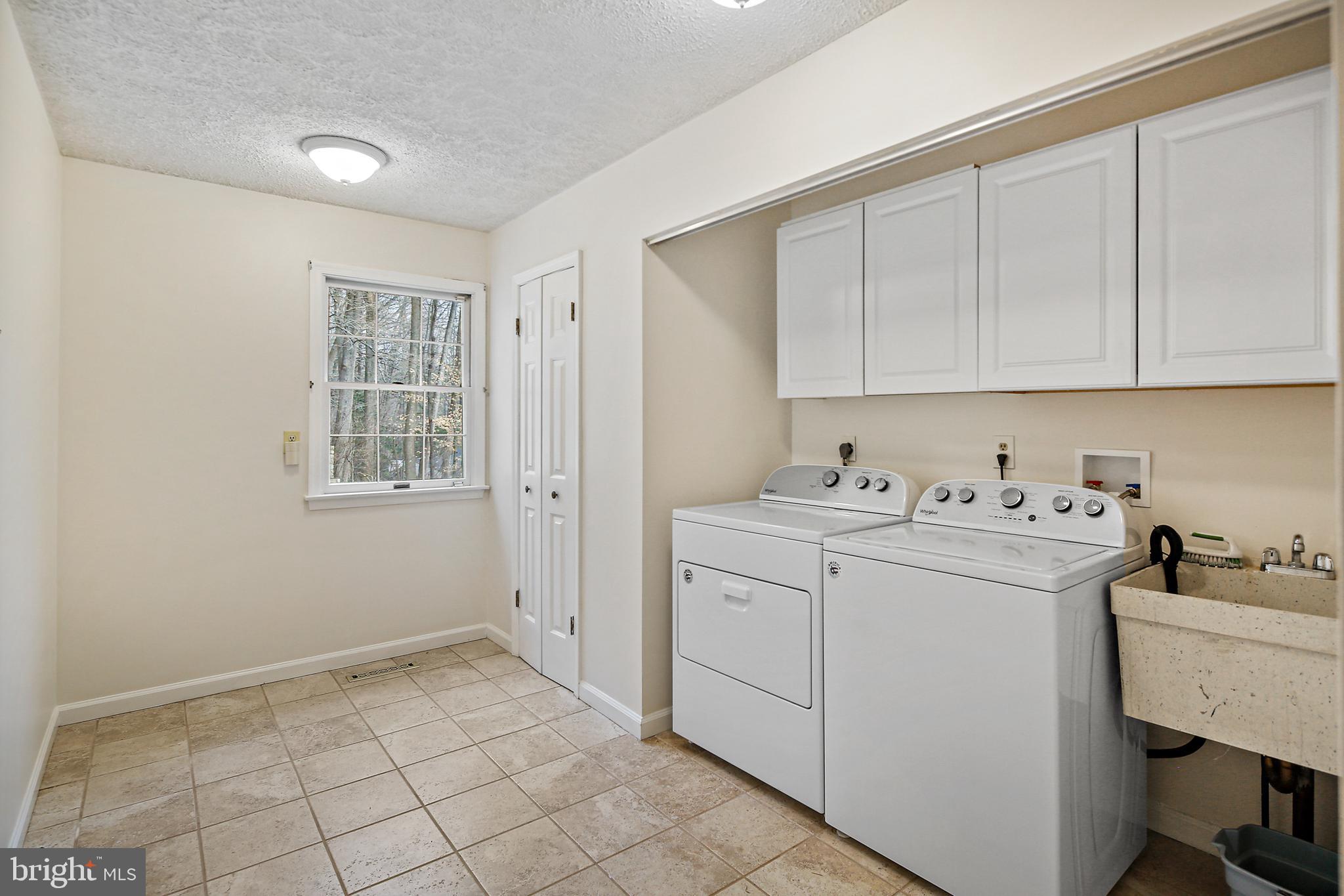 13414 Bladon Road Phoenix, MD 21131 - Photo 25 of 41 Laundry Room With Washer, Dryer & Ceramic Tile