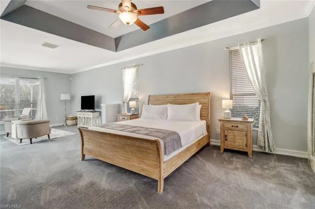 a bed room with a bed and a chair