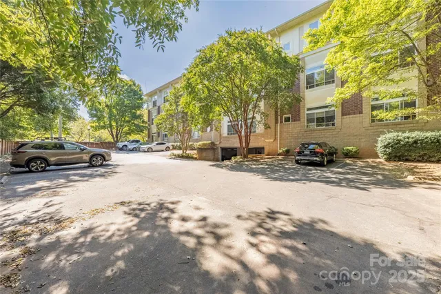 a view of a road with a building in the background