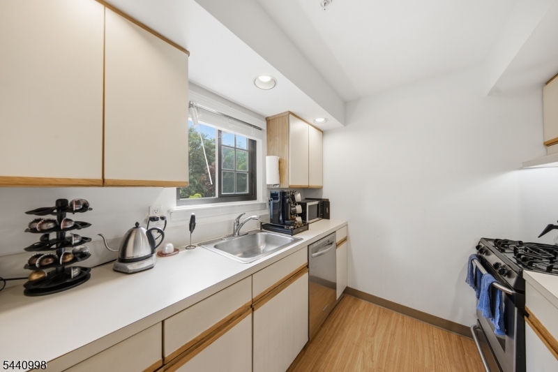 609 Mark Twain Way Mahwah, NJ 07430 - Photo 26 of 40 a kitchen with a sink and wooden floor