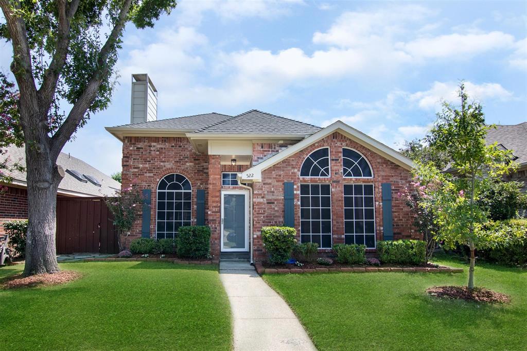 522 Raintree Circle Coppell, TX 75019 - Photo 1 of 1 a view of a big house with a big yard and large trees