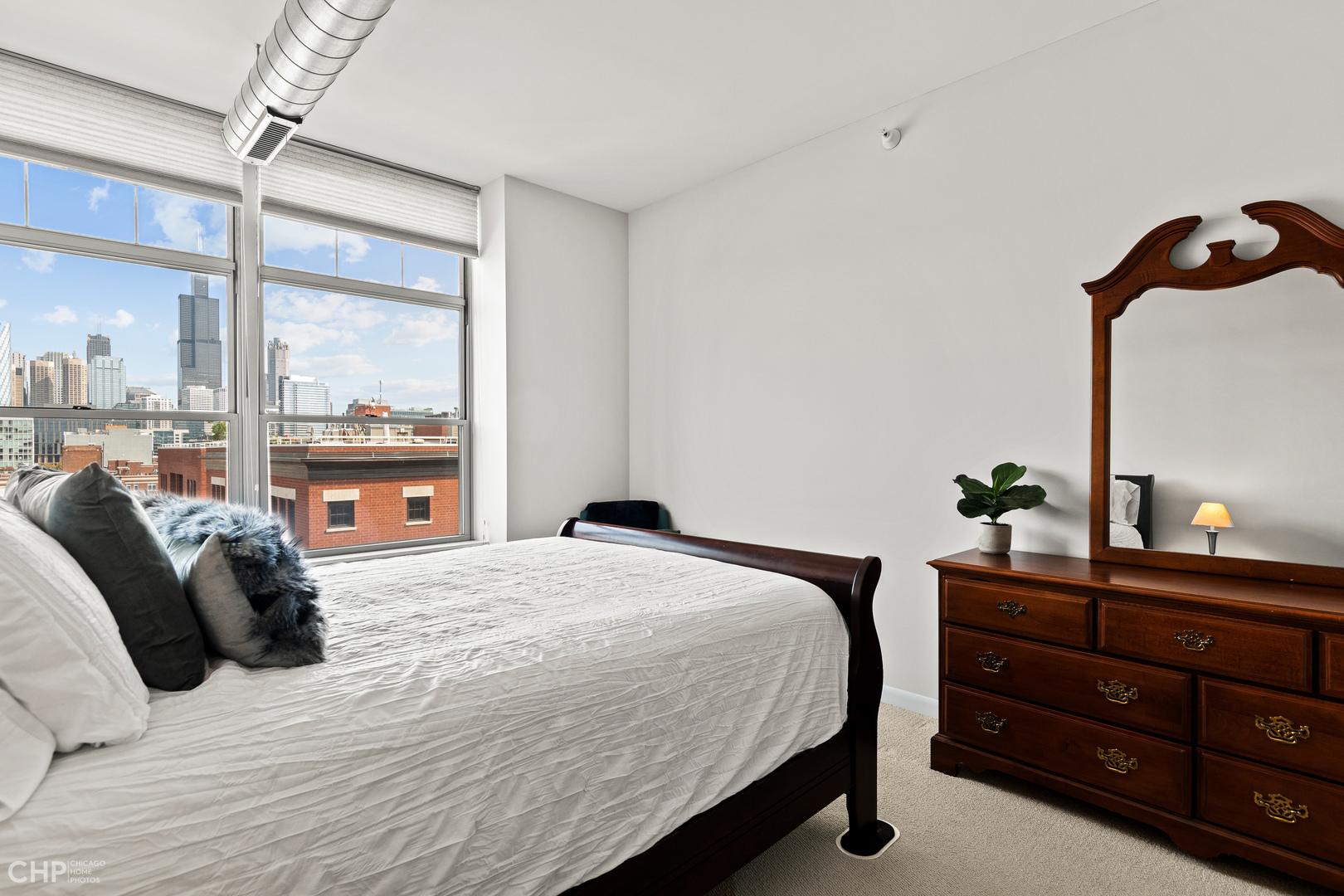 1200 West Monroe Street, Unit 805 Chicago, IL 60607 - Photo 11 of 18 a bedroom with a bed and a window