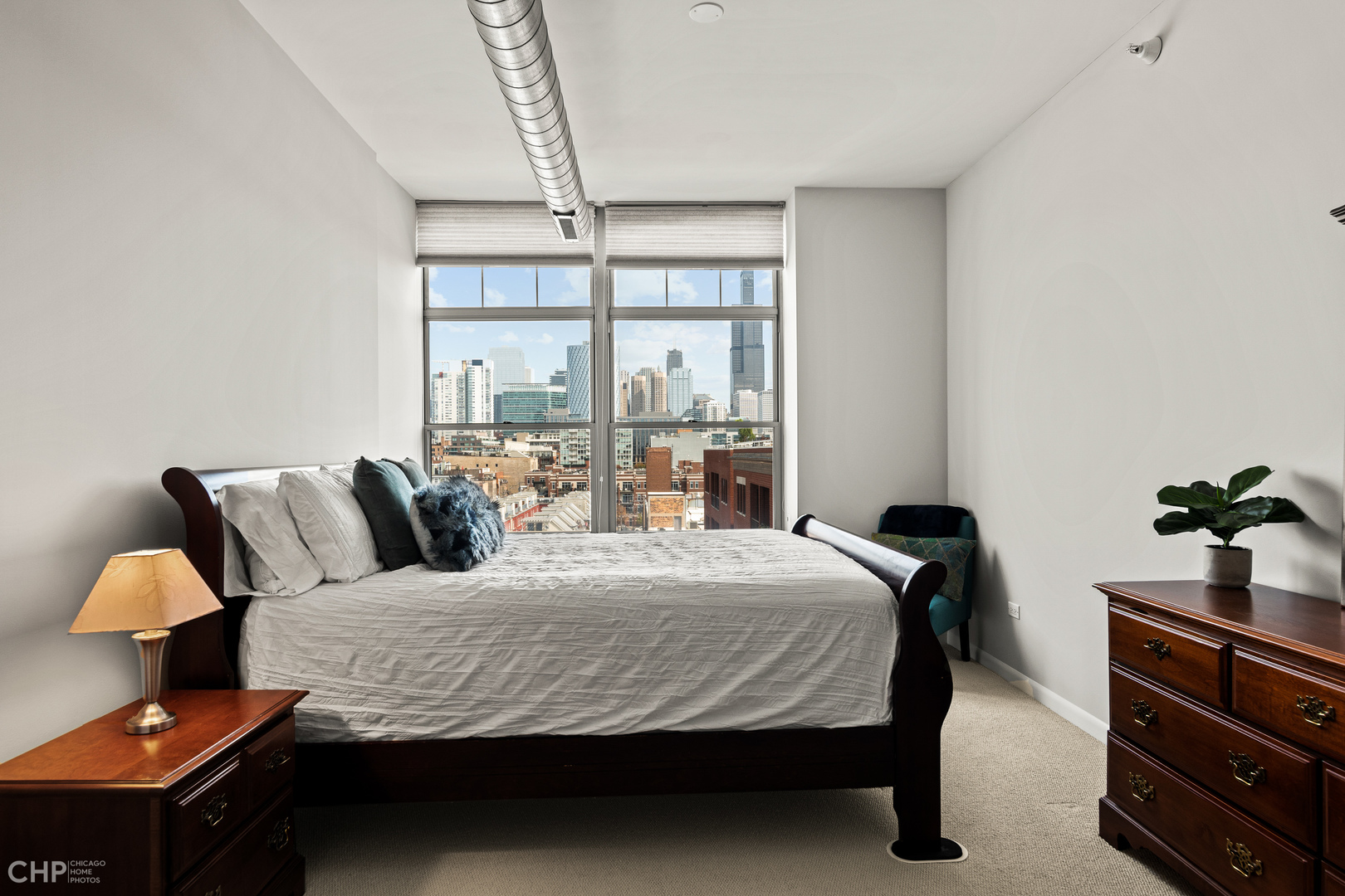 1200 West Monroe Street, Unit 805 Chicago, IL 60607 - Photo 12 of 18 a bedroom with a bed and window