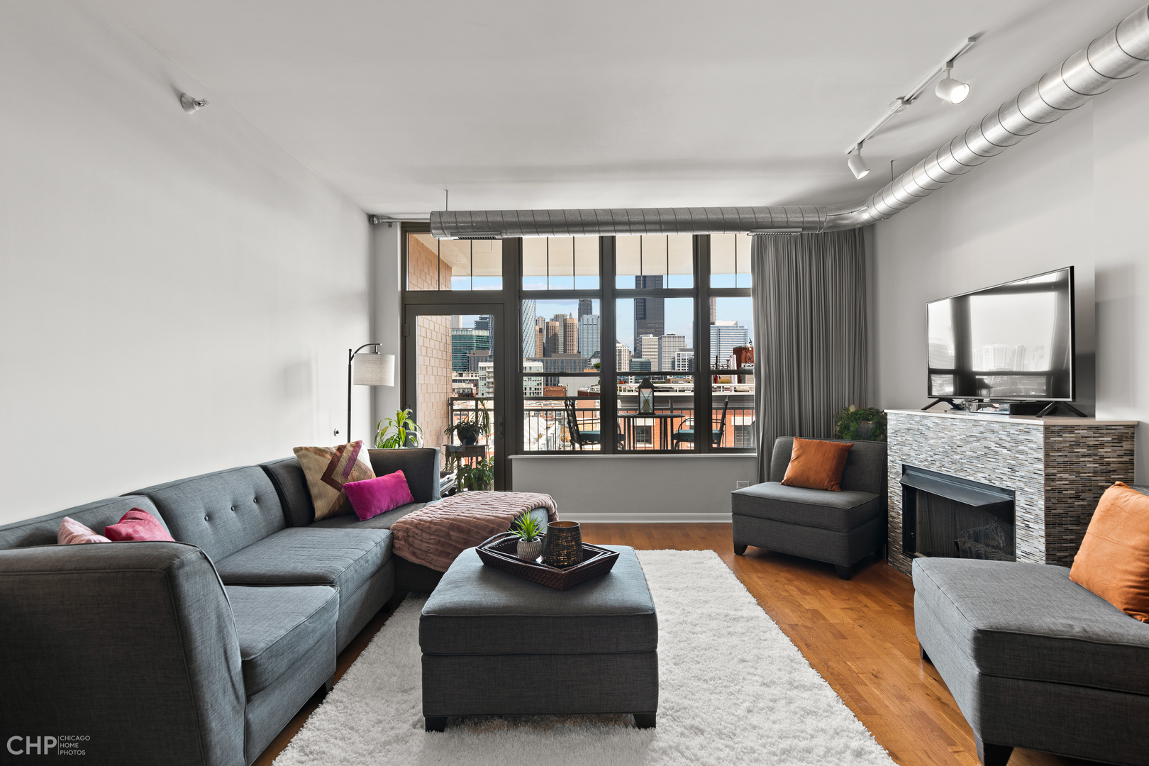 1200 West Monroe Street, Unit 805 Chicago, IL 60607 - Photo 4 of 18 a living room with furniture and a large window
