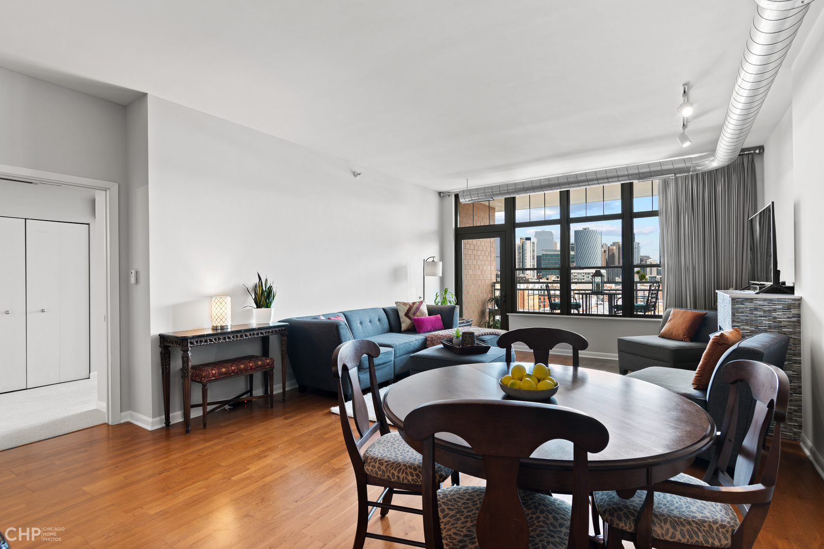 1200 West Monroe Street, Unit 805 Chicago, IL 60607 - Photo 9 of 18 a living room with furniture and a large window