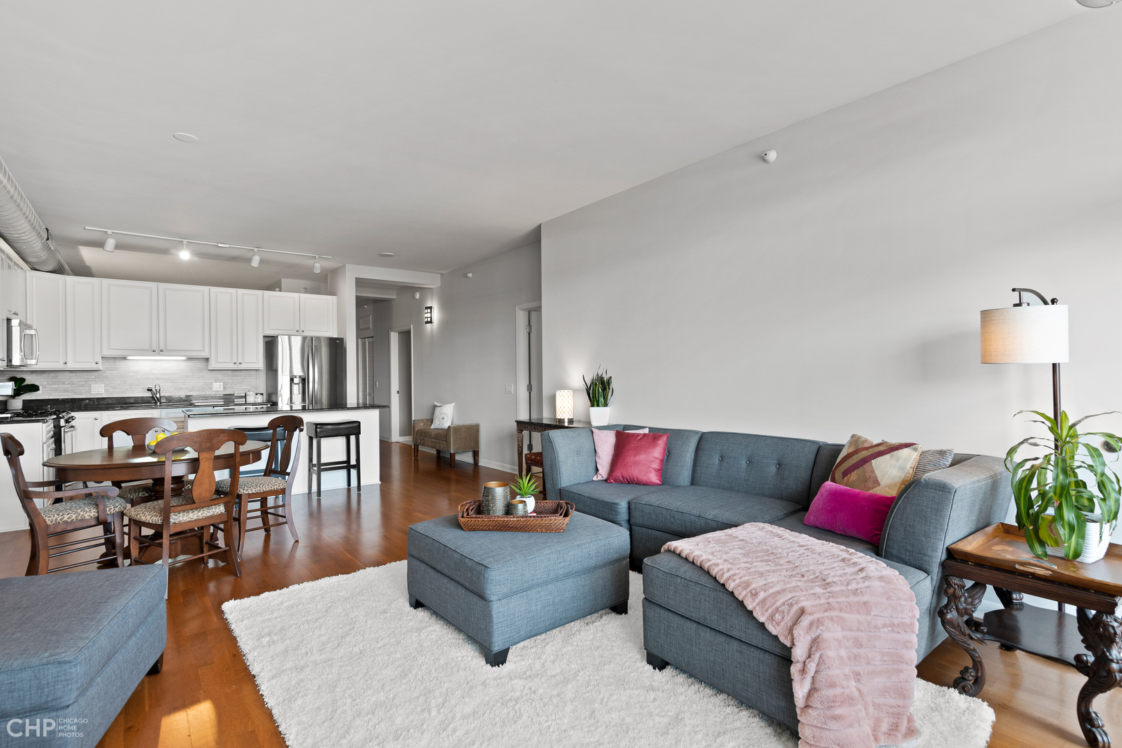 1200 West Monroe Street, Unit 805 Chicago, IL 60607 - Photo 10 of 18 a living room with furniture and wooden floor