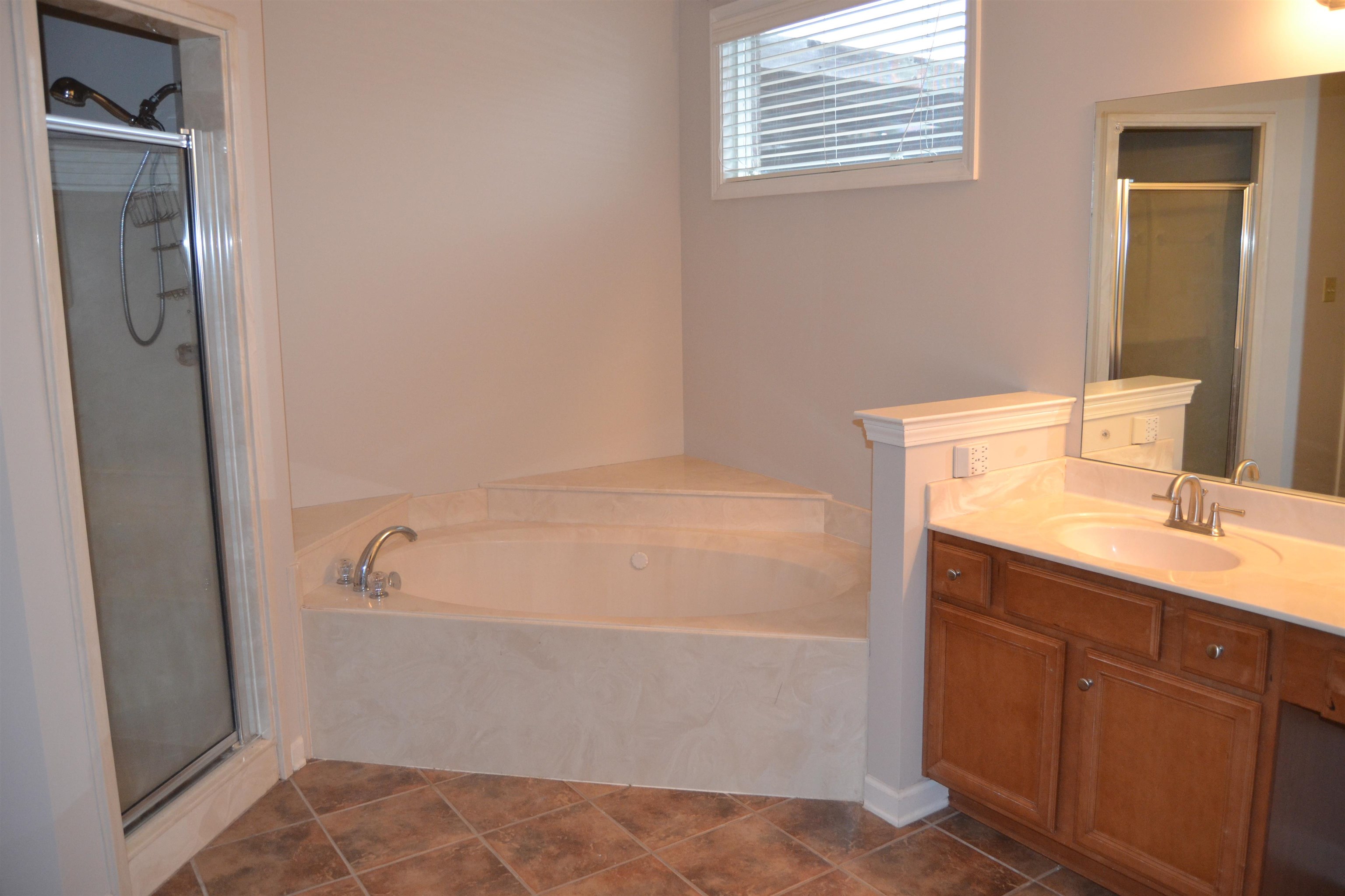 10486 Juneau Way Collierville, TN 38017 - Photo 30 of 33 Bathroom with tile patterned floors, vanity, and separate shower and tub