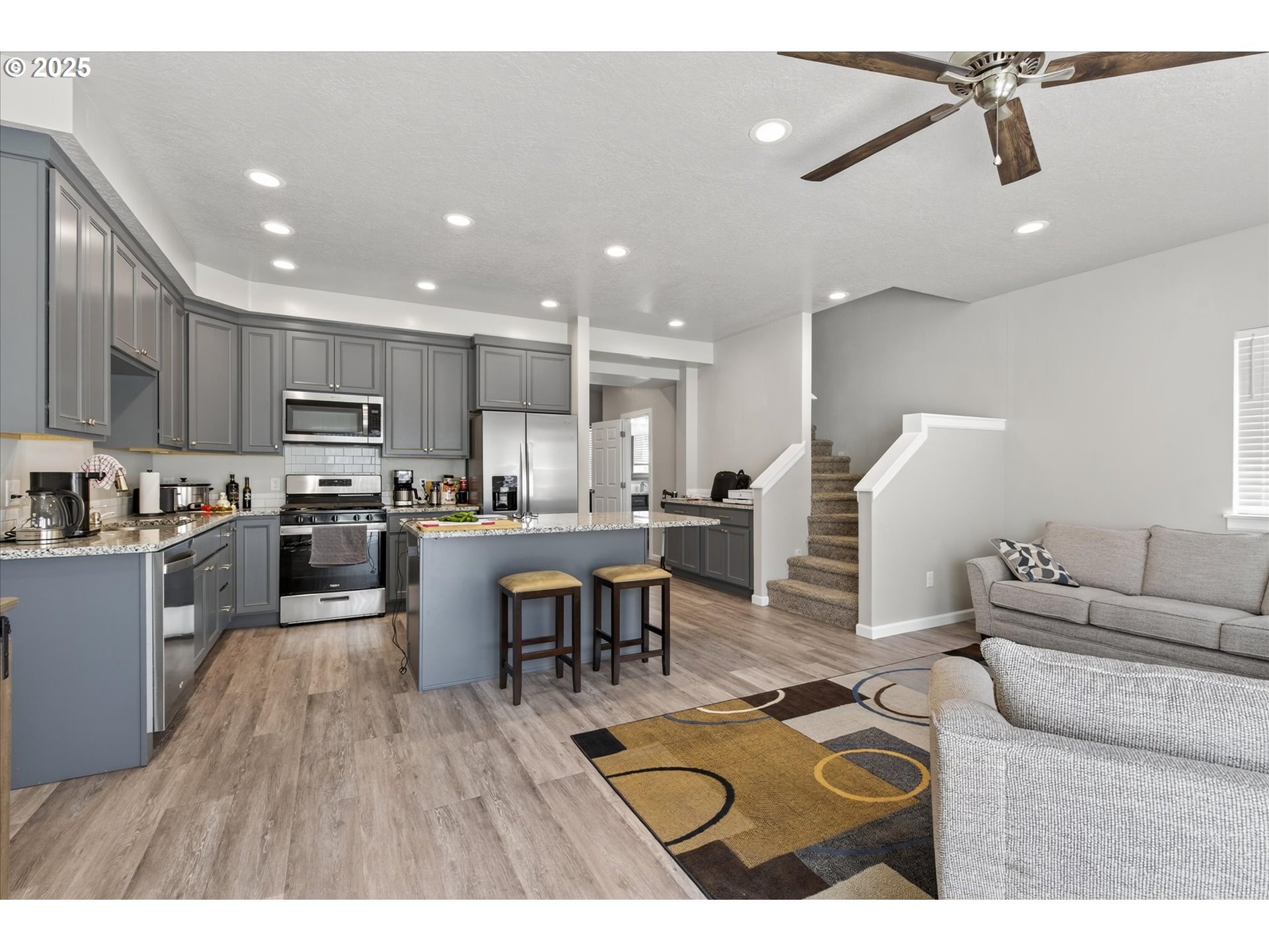 585 Baker Street Baker City, OR 97814 - Photo 18 of 36 a living room with furniture and kitchen view