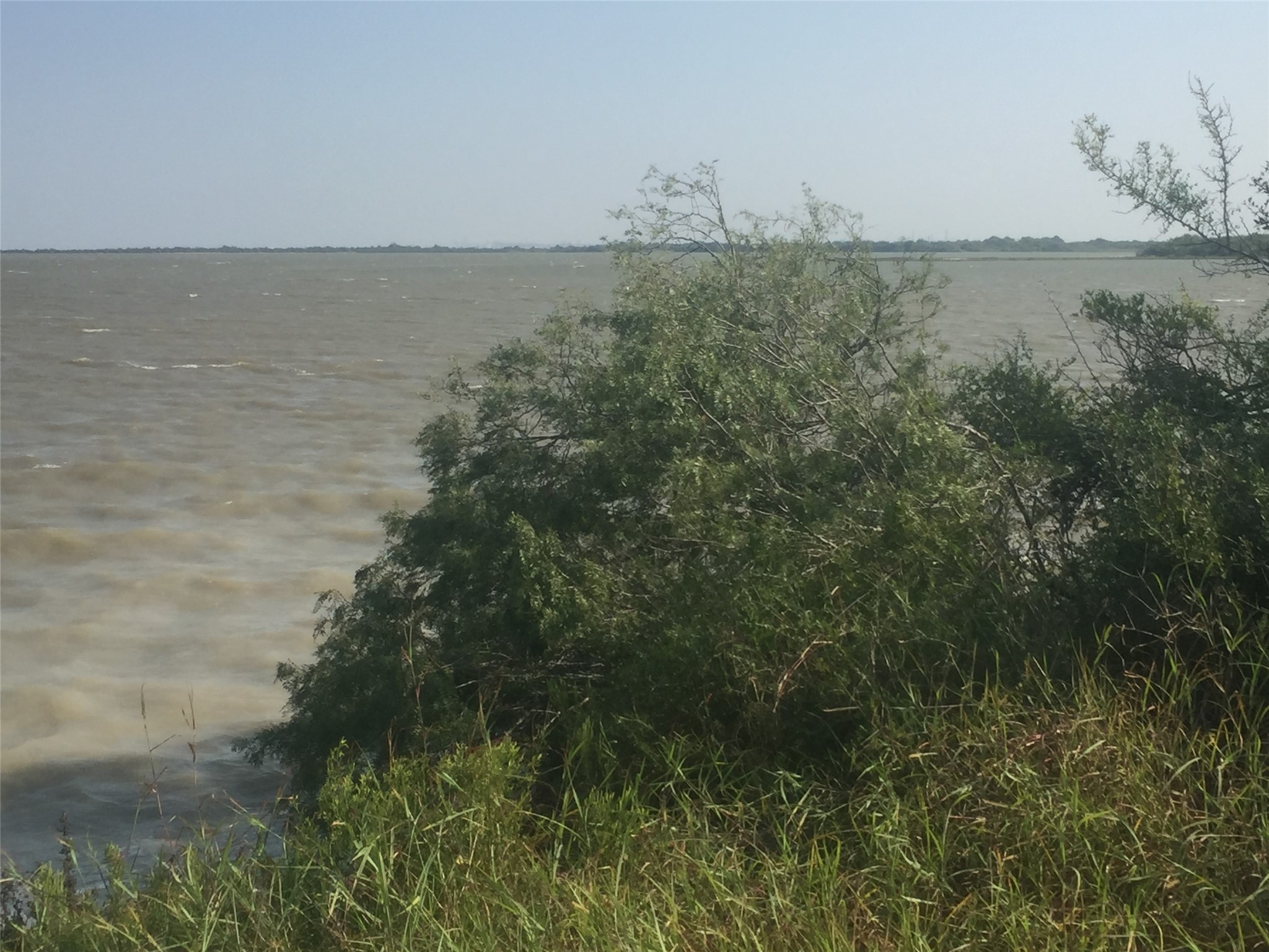 3 Redfish Lane Port Lavaca, TX 77979 - Photo 4 of 11 a view of a lake and mountain in the back