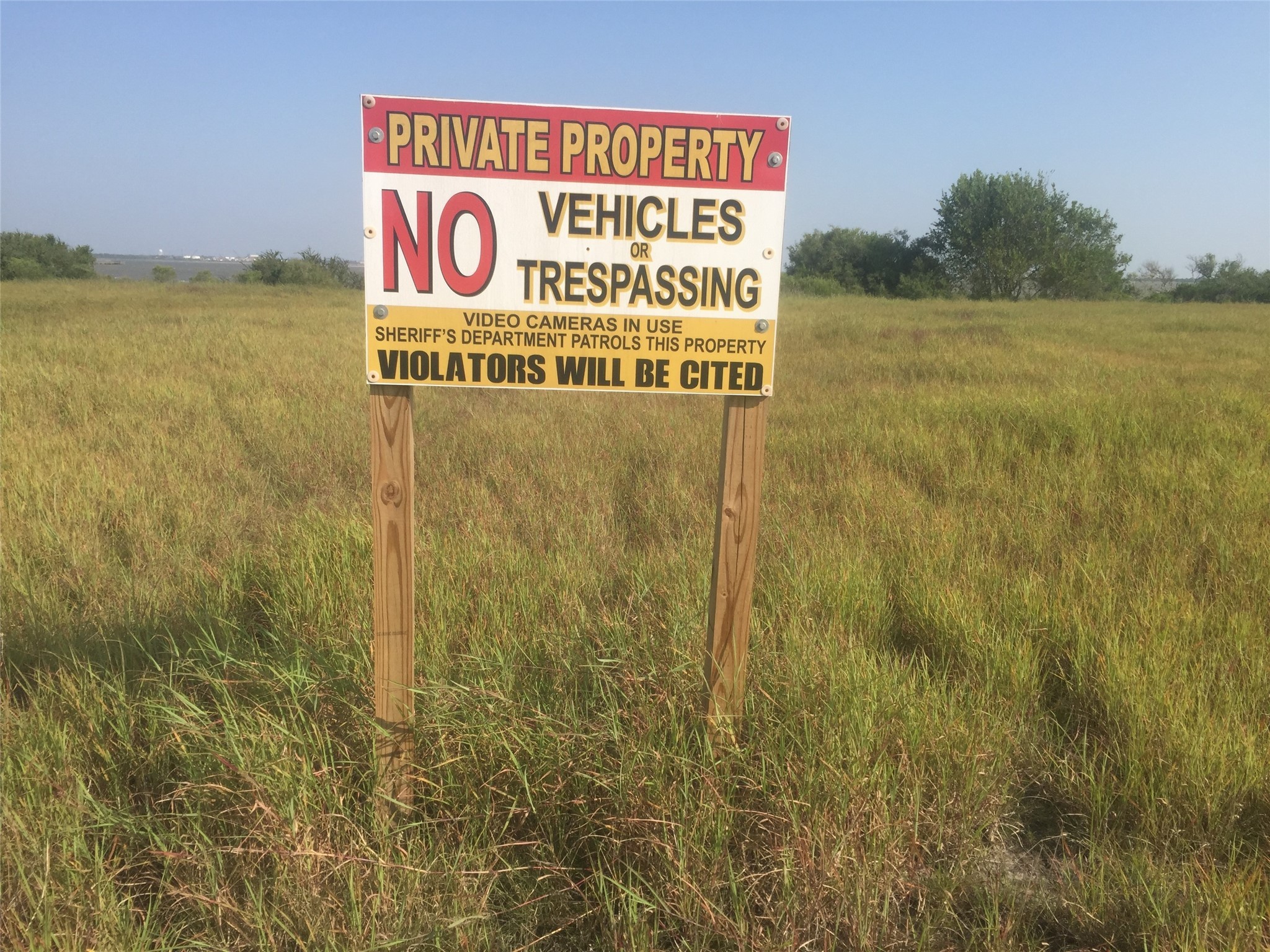 3 Redfish Lane Port Lavaca, TX 77979 - Photo 6 of 11 a sign on the wall next to a lake