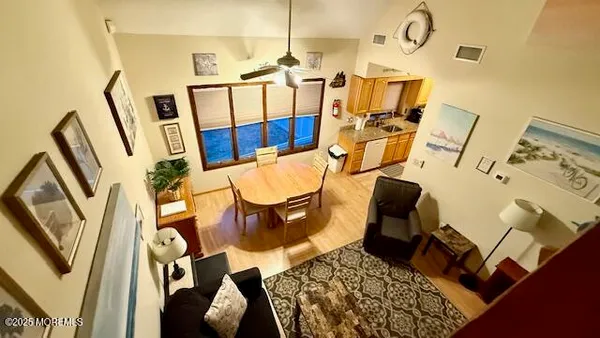 a balcony view with table and chairs