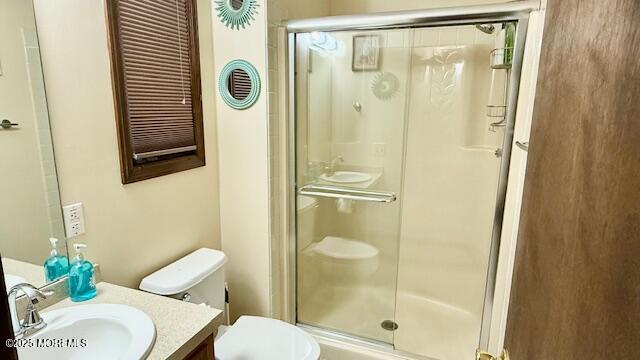 210 Sumner Avenue, Unit 5 Seaside Heights, NJ 08751 - Photo 17 of 20 a bathroom with a shower a toilet and a sink