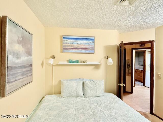 210 Sumner Avenue, Unit 5 Seaside Heights, NJ 08751 - Photo 8 of 20 a bedroom with a large bed and a painting on the wall