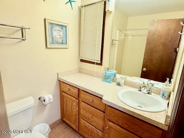 a bathroom with a shower and a toilet