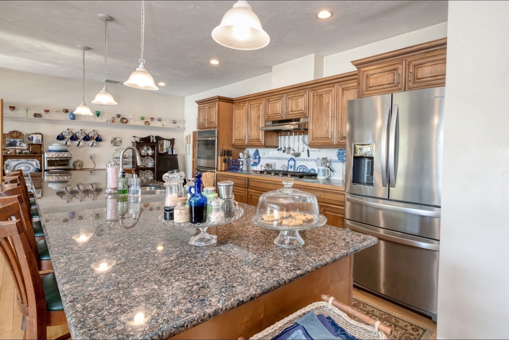 130 Scadding Street Taunton, MA 02780 - Photo 11 of 42 a kitchen with stainless steel appliances granite countertop a sink refrigerator and cabinets