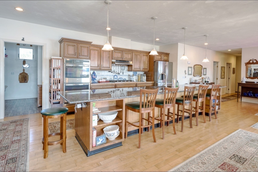 130 Scadding Street Taunton, MA 02780 - Photo 12 of 42 a large kitchen with a table and chairs