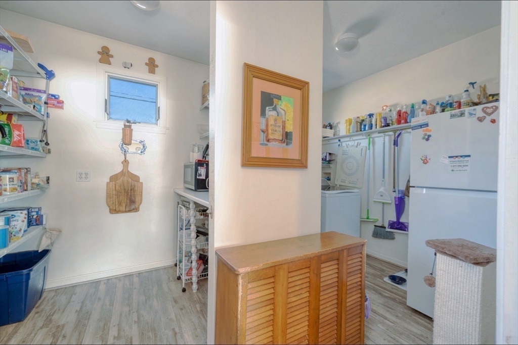 130 Scadding Street Taunton, MA 02780 - Photo 13 of 42 a room with a book shelf and a couch