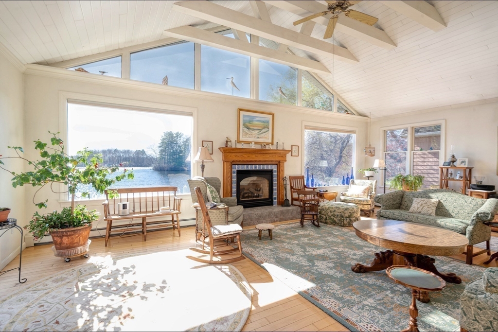 130 Scadding Street Taunton, MA 02780 - Photo 15 of 42 a living room with furniture a fireplace and a table
