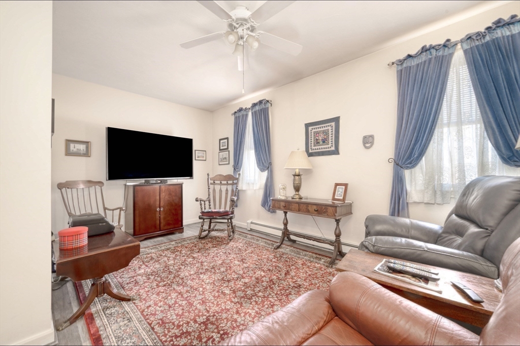 130 Scadding Street Taunton, MA 02780 - Photo 20 of 42 a living room with furniture and a flat screen tv