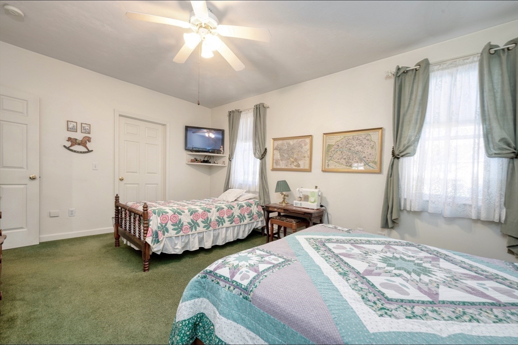 130 Scadding Street Taunton, MA 02780 - Photo 23 of 42 a bedroom with two beds and painting on the wall
