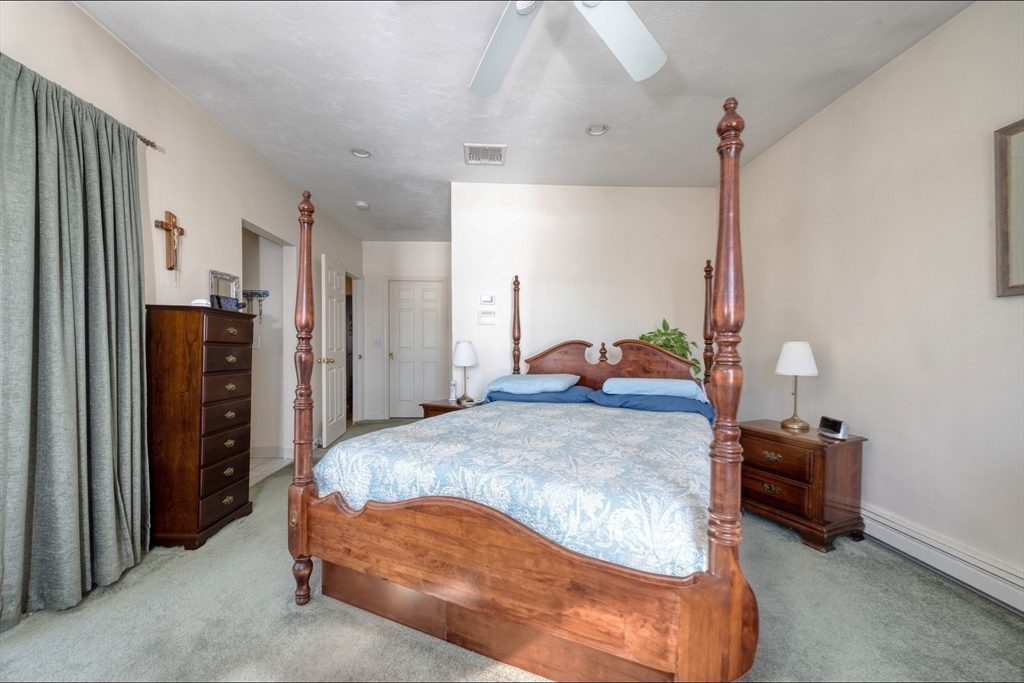 130 Scadding Street Taunton, MA 02780 - Photo 25 of 42 a bedroom with a bed and a closet