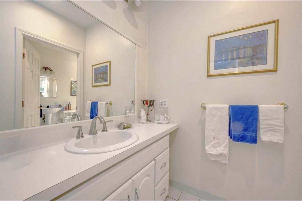 130 Scadding Street Taunton, MA 02780 - Photo 27 of 42 a bathroom with a sink and a mirror