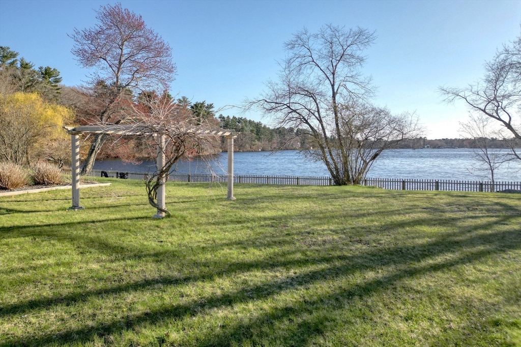 130 Scadding Street Taunton, MA 02780 - Photo 4 of 42 a view of a backyard with a tree