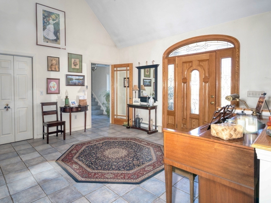 130 Scadding Street Taunton, MA 02780 - Photo 9 of 42 a living room with furniture and a table