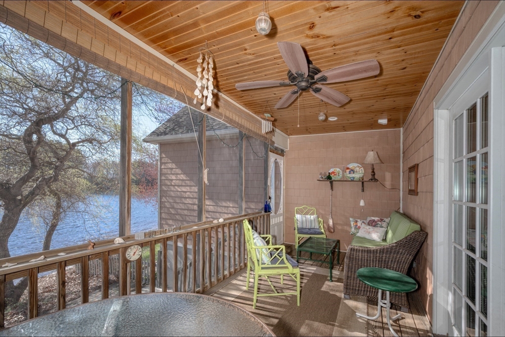 130 Scadding Street Taunton, MA 02780 - Photo 10 of 42 a view of a patio with a table and chairs